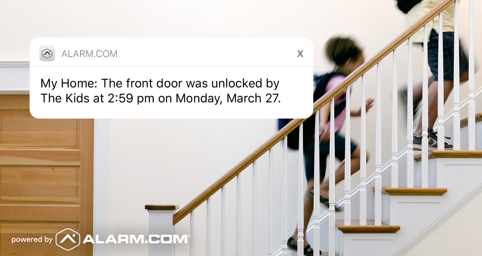 Kids heading up stairs, notification box on picture from app that front door was unlocked