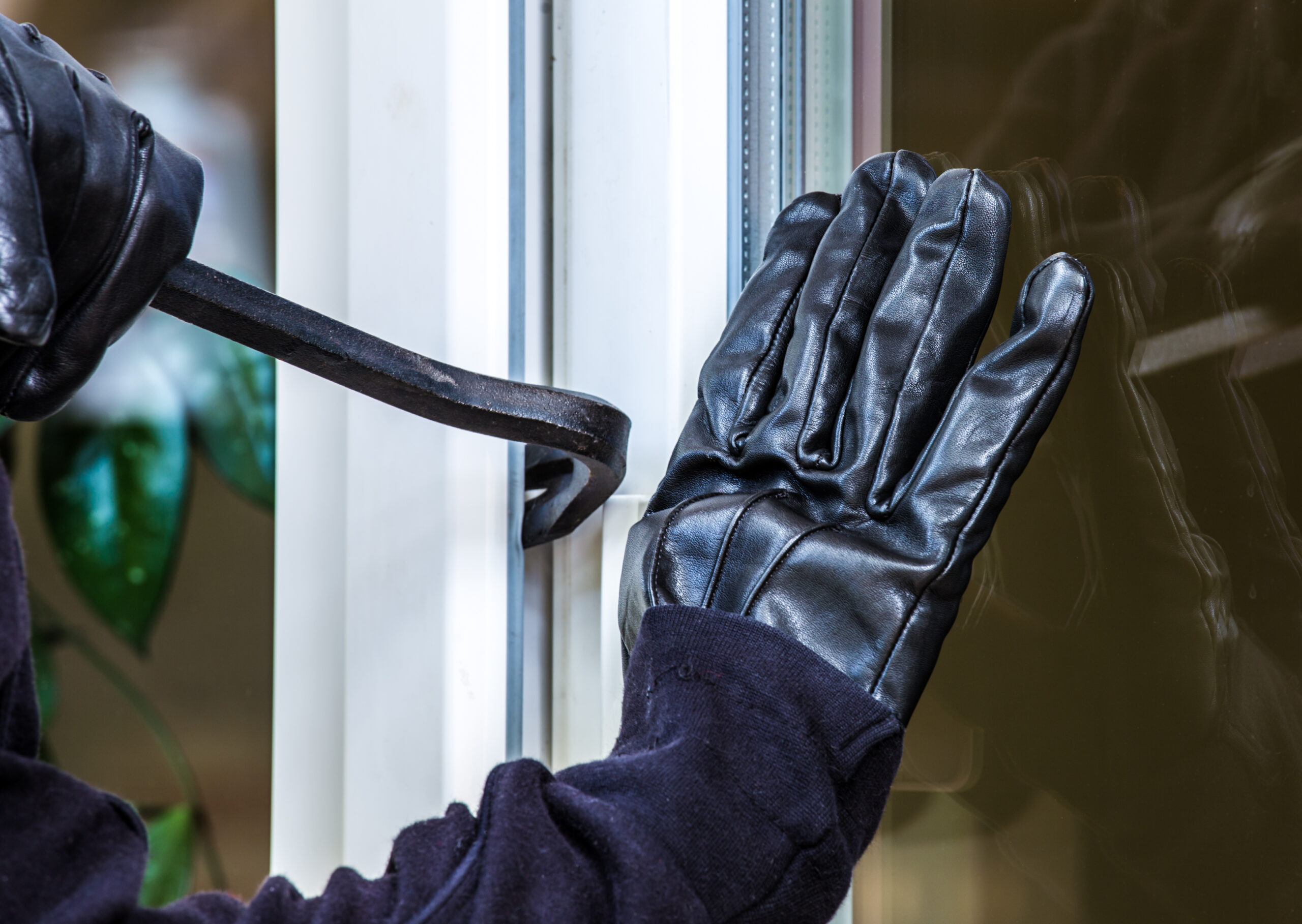 burglar attempting to pry open door